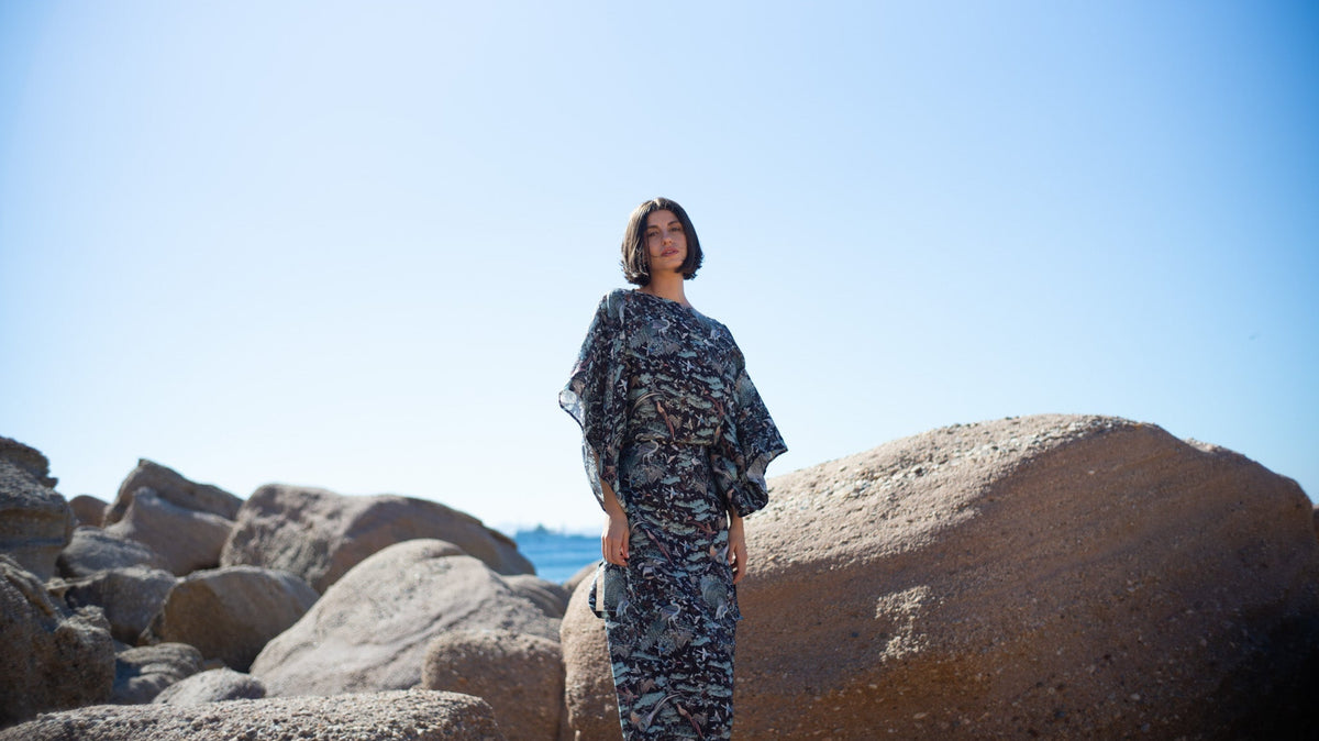 Woman wearing the LUXMII Kimonos Dress in Najeon Print in the sunshine