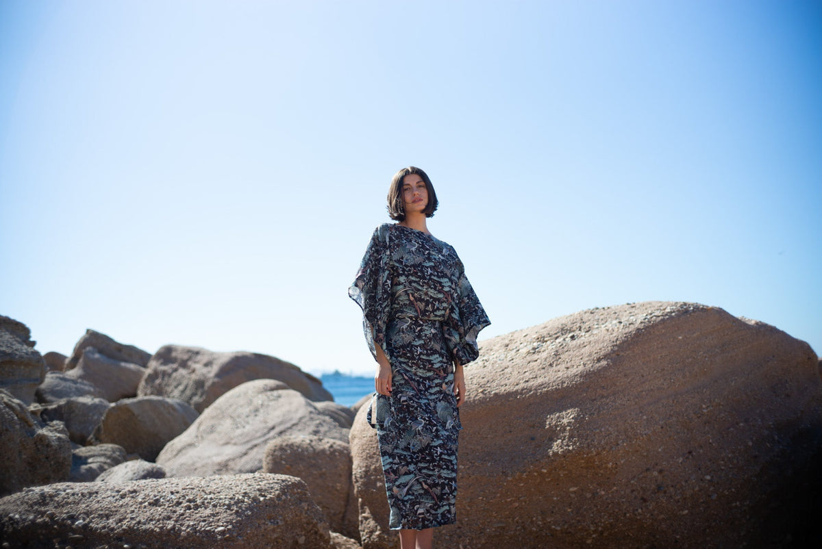 Woman wearing the LUXMII Kimonos Dress in Najeon Print in the sunshine